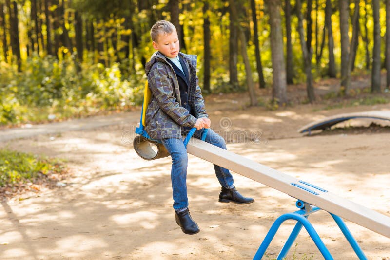 Children Playing on a School Playground during Recess. Stock Photo