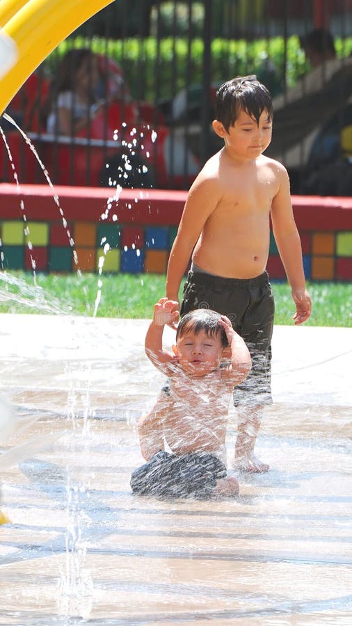 Children playing in a splash zone at local park