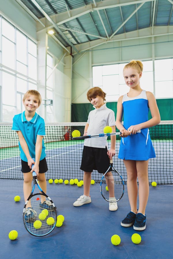 Children Playing Tennis and Posing Indoor Stock Photo Image of hold
