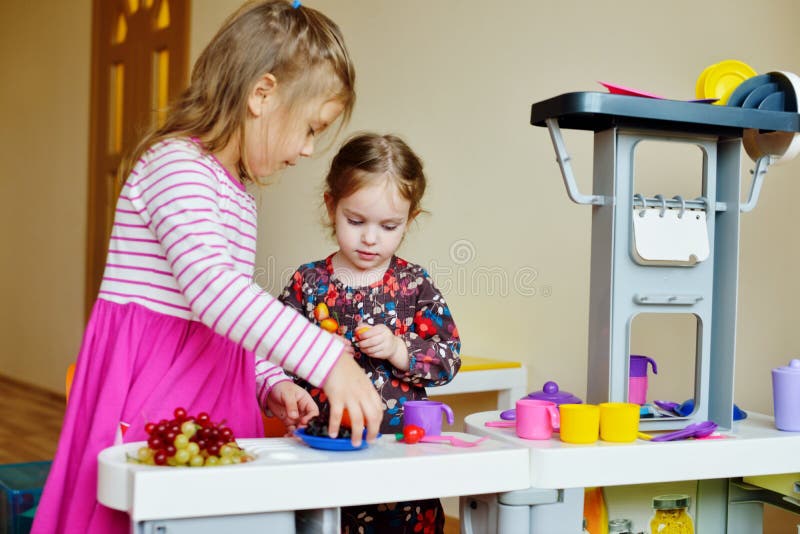 Children Playing Toy Kitchen Stock Photo - Image of nursery, cook: 66796002