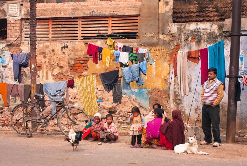 Children of poor family play outdoor near the village house with drying clothes royalty free stock images Children of poor family play outdoor near the village house with drying clothes royalty free stock images