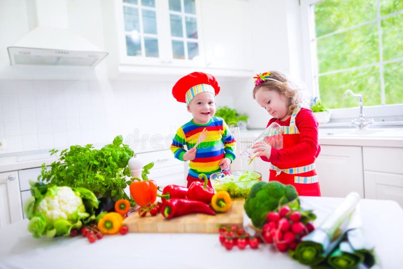 Children preparing healthy vegetable lunch