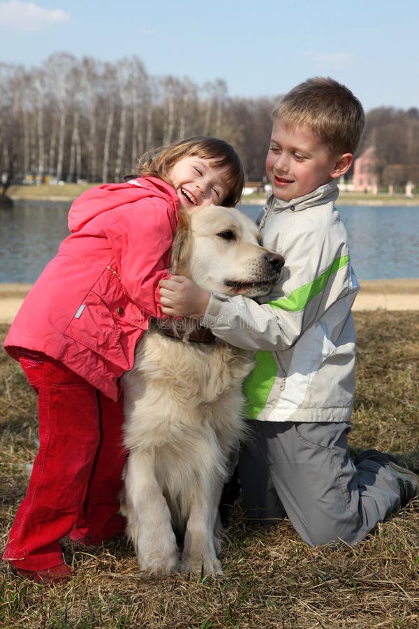 Children with retriever outdoor