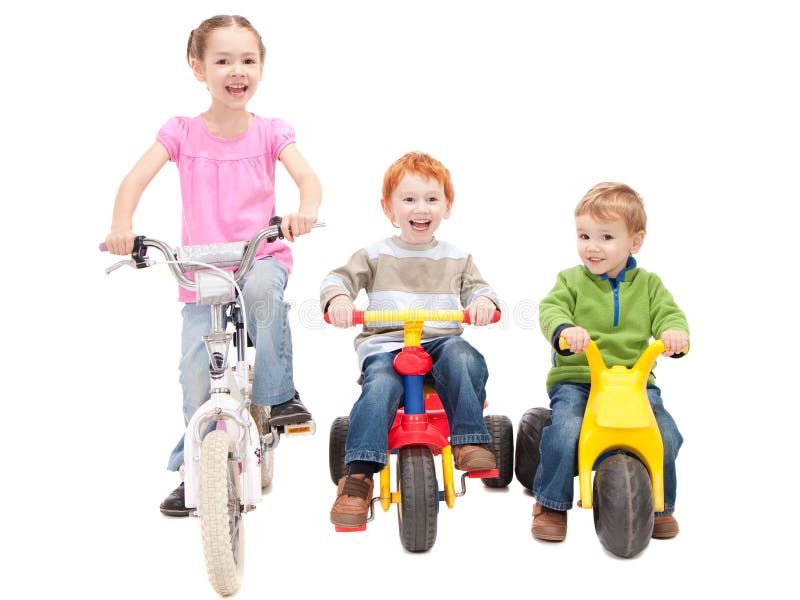 Three kids riding bikes and trikes. Isolated on white. Three kids riding bikes and trikes. Isolated on white.