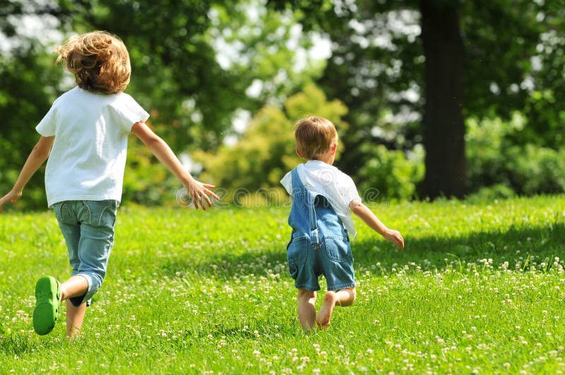 Children running outdoors royalty free stock photo
