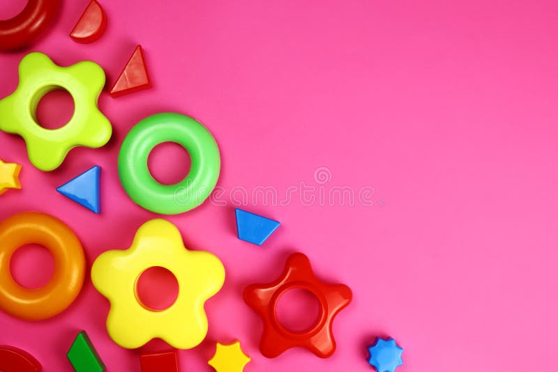 Children&#x27;s bright background of toys on pink royalty free stock images