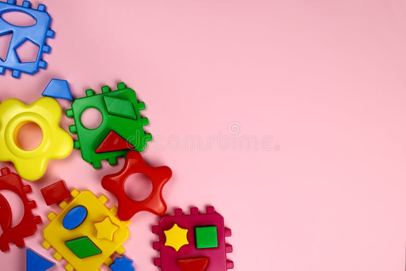 Children&#x27;s bright background of toys on pink stock photo