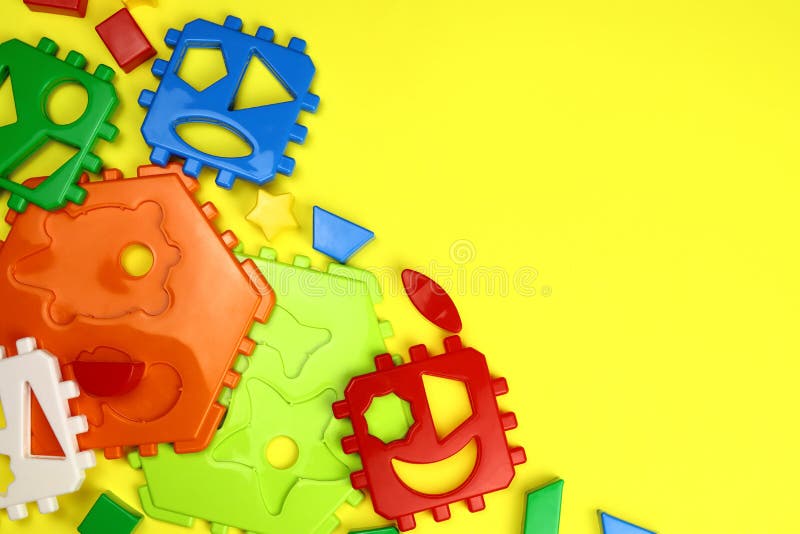 Children&#x27;s bright background of toys on yellow royalty free stock photos
