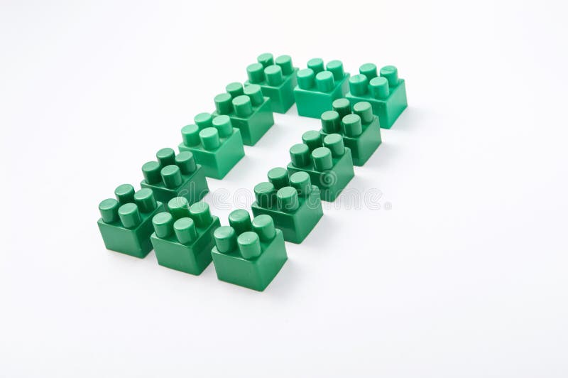Figures from a colored cubes designer on a white background stock image