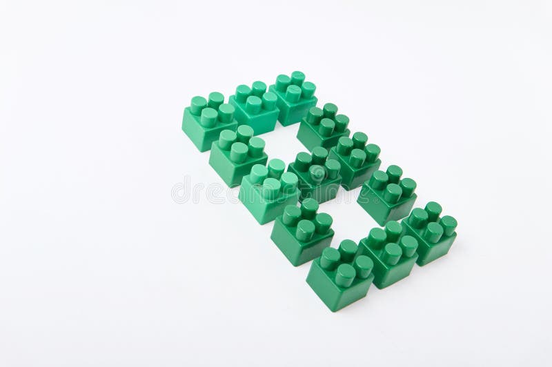Figures from a colored cubes designer on a white background stock photo