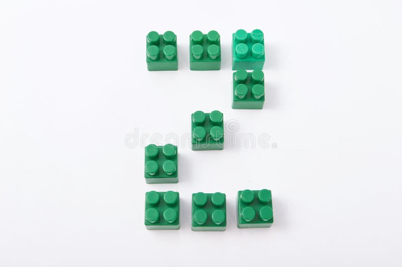 Figures from a colored cubes designer on a white background stock image