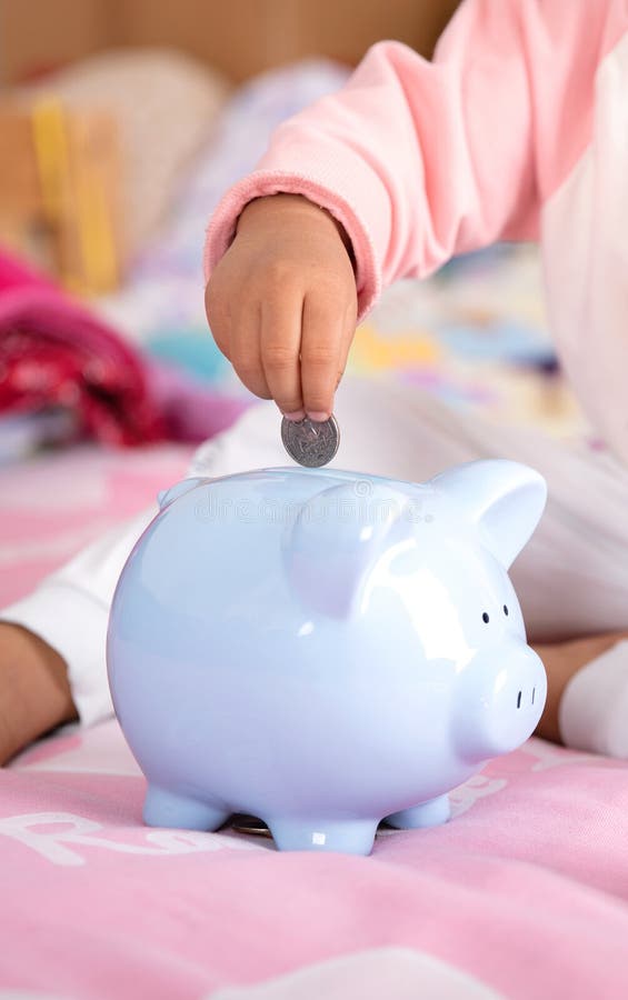 Children`s Financial Savings on Bed Stock Photo Image of little