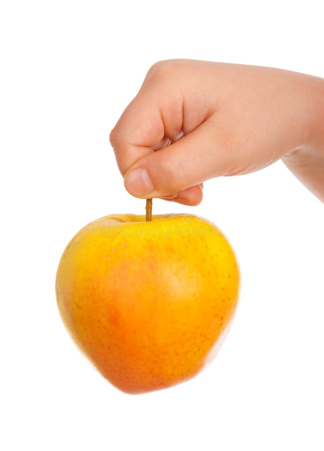 Children s hand with an apple on the white