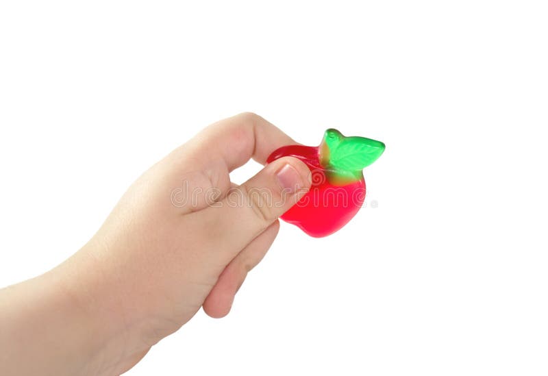 Children s hand holds fruit candy