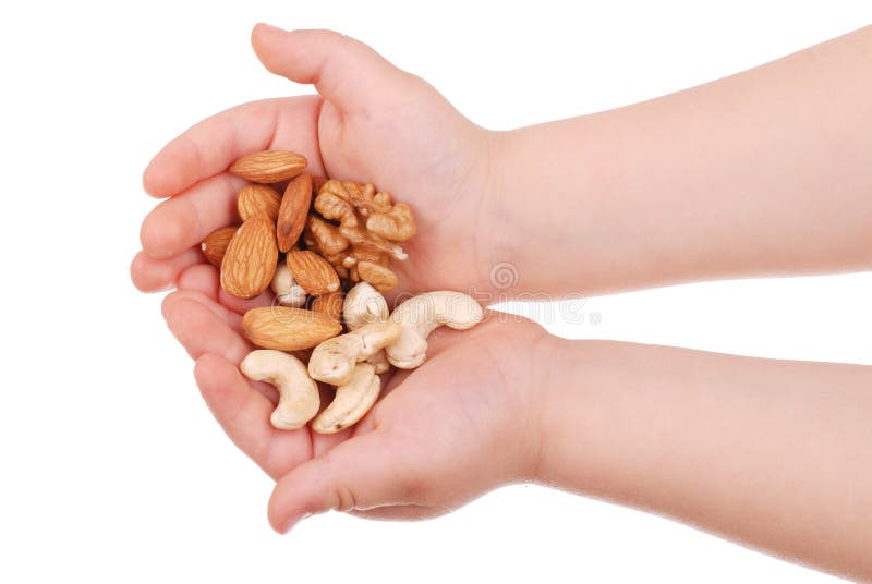 The children s hand holds nuts