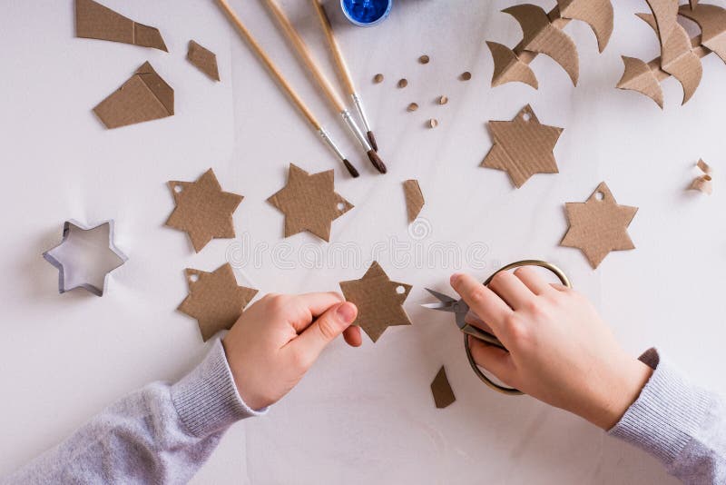 Children`s Hands Cut Out Stars from Cardboard for DIY Christmas ...