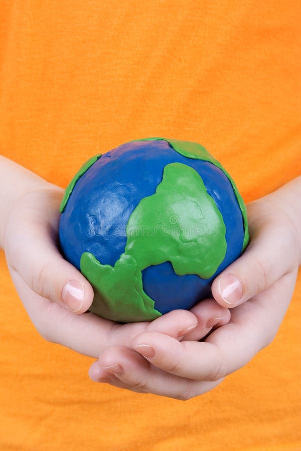 Children s hands holding a globe