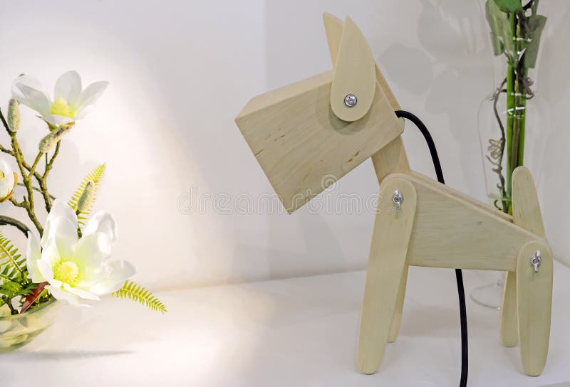 Children`s lamp in the form of a wooden doggie stock images