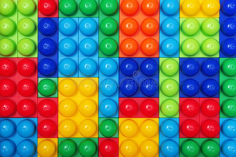 Children s multi-colored constructor as an abstract background. Multicolored blocks close-up.