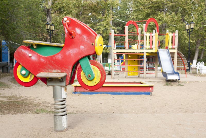 Children`s Playground In The Courtyard Of The House Swings Slides