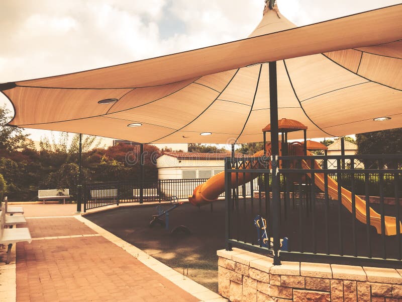 Children`s playground are shadow under a tent