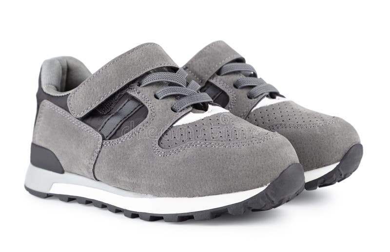 Children`s sports sneakers of gray color, boyish casual shoes is