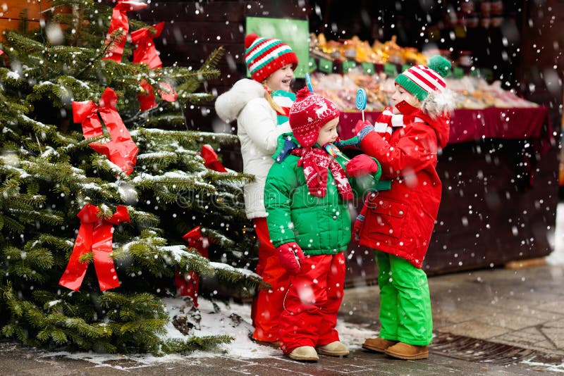 Kids at Christmas fair. Child at Xmas market. stock photo Kids at Christmas fair. Child at Xmas market. stock photo