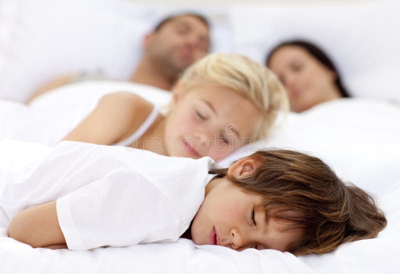 Children Sleeping with His Parents Stock Image - Image of lifestyle