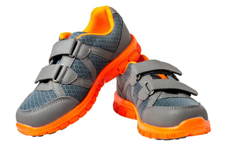 Children sneakers with bright orange trim royalty free stock photography Children sneakers with bright orange trim royalty free stock photography