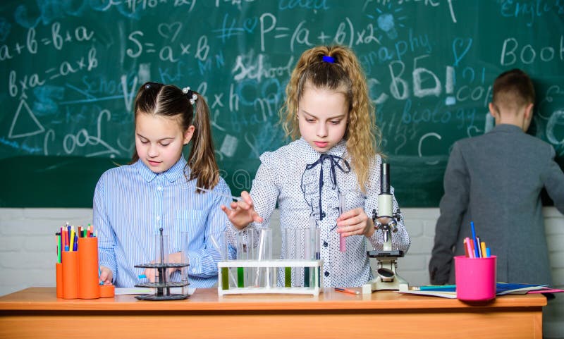 Children study biology or chemistry school. School education. School girls study. Explore biological molecules. Future.