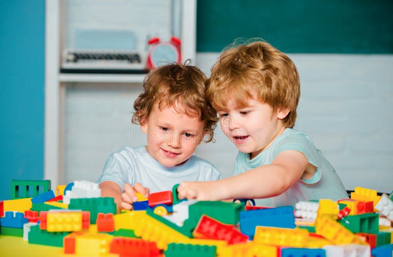 Children study in preschool. Cute little preschool kids boys pupils in a classroom at school. Happy cute child is royalty free stock photography