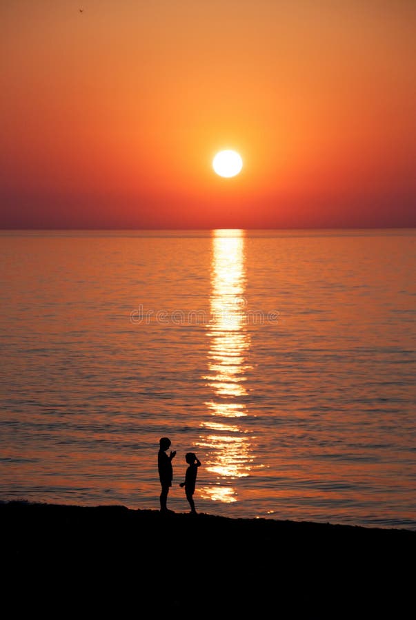 Children in sunset at the sea. Batumi.