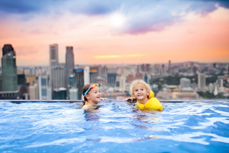 Kids swim in Singapore roof top swimming pool