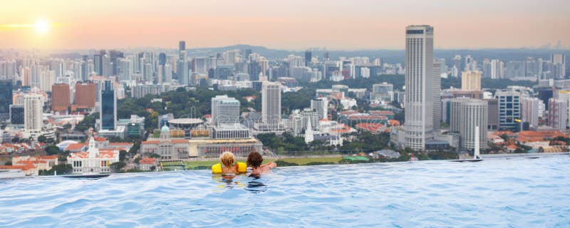 Kids swim in Singapore roof top swimming pool