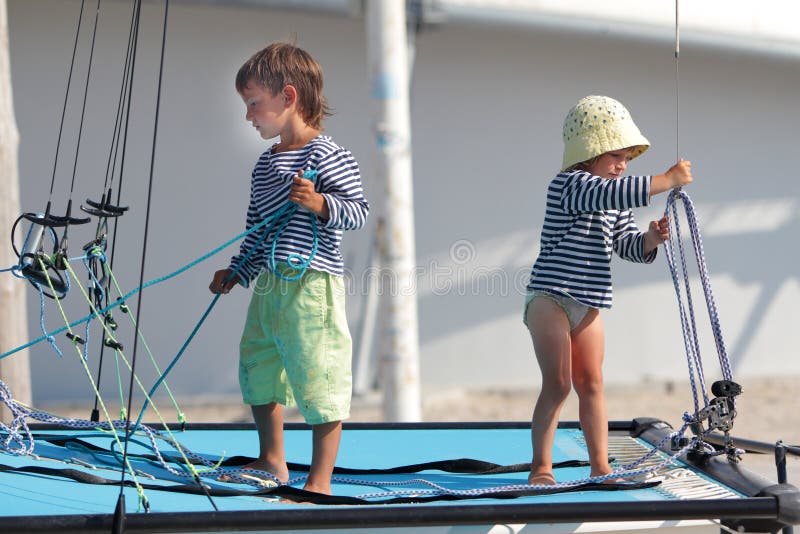 Children traveling on sea yacht