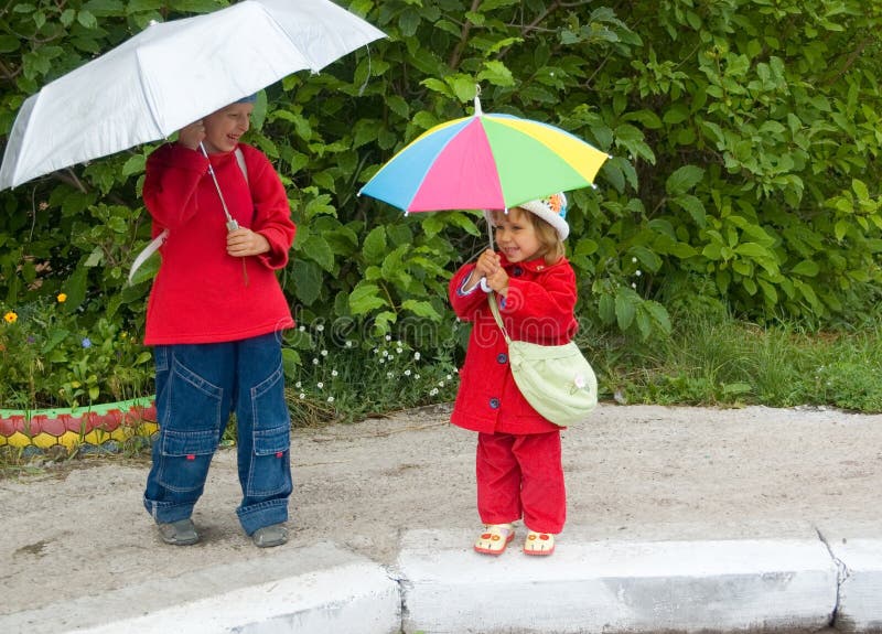 Children with umbrellas