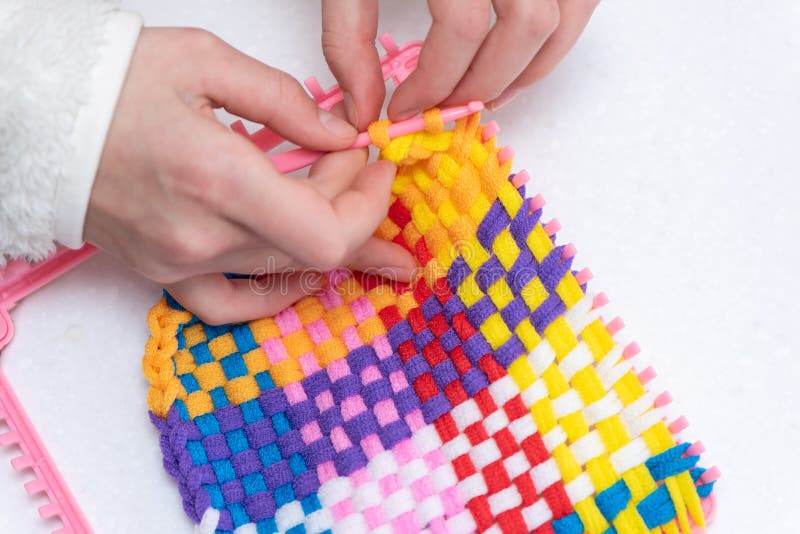 Childrens Creativity Weaving with Colored Threads Ropes Stock Photo