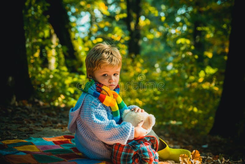 Childrens friendship. Atumn fun at the park. Happy kids autumn. Cute boy with Autumn Leaves on Fall Nature Background royalty free stock photo Childrens friendship. Atumn fun at the park. Happy kids autumn. Cute boy with Autumn Leaves on Fall Nature Background royalty free stock photo