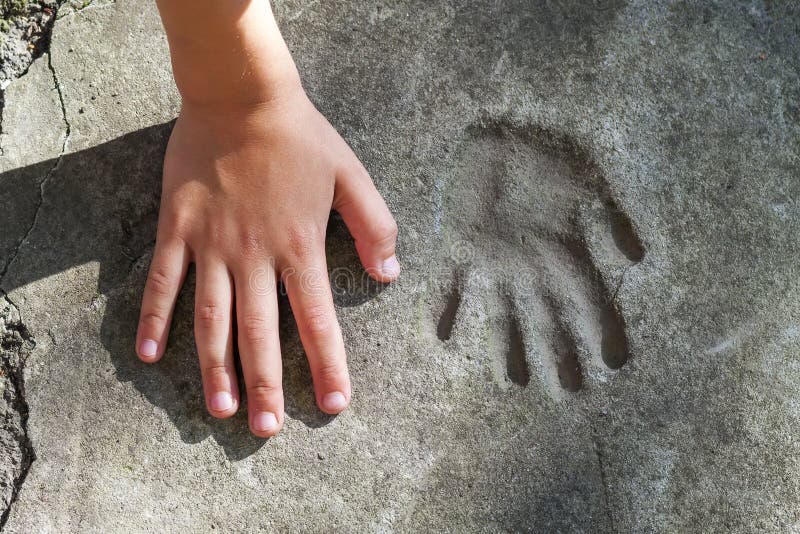 Childs Hand and Memorable Handprint in Concrete Stock Photo - Image of