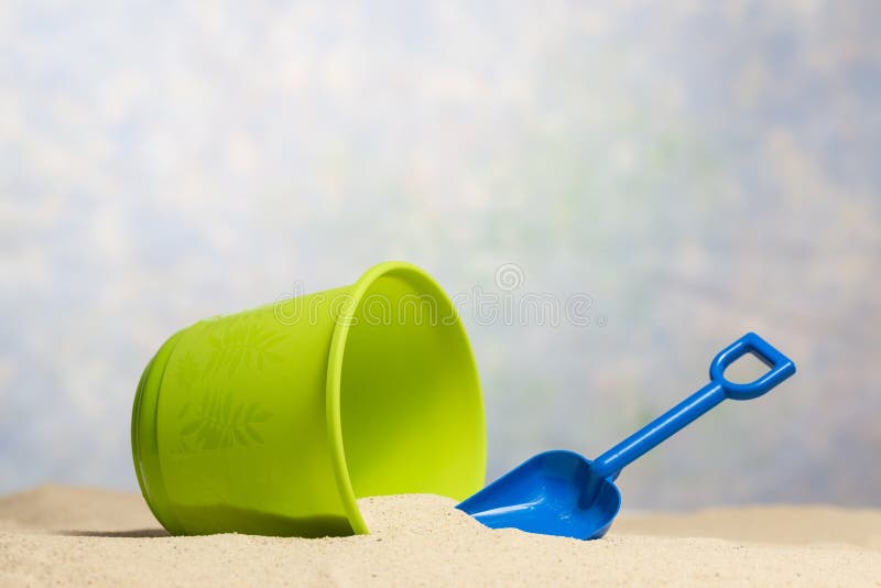 Child’s Sand Bucket and Shovel Beach Scene With Copy Space