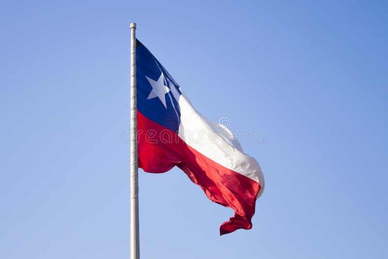 Chilean Flag Flying Over The Blue Sky And Inka Symbols In Atacama Desert, Chile Stock Image