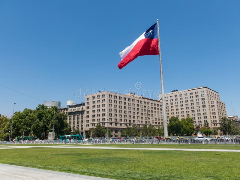 Chileans walking near the giant flag on Avenida La Alameda with the citizenship Square, in downtown Santiago de Chile. Chile royalty free stock images Chileans walking near the giant flag on Avenida La Alameda with the citizenship Square, in downtown Santiago de Chile. Chile royalty free stock images
