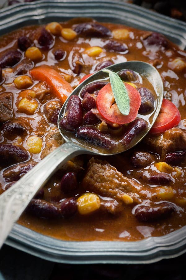 Chili con carne plate. Mexican traditional dish in rustic setting