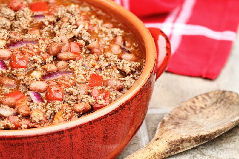 Chili Con Carne in a red ceramic pot.