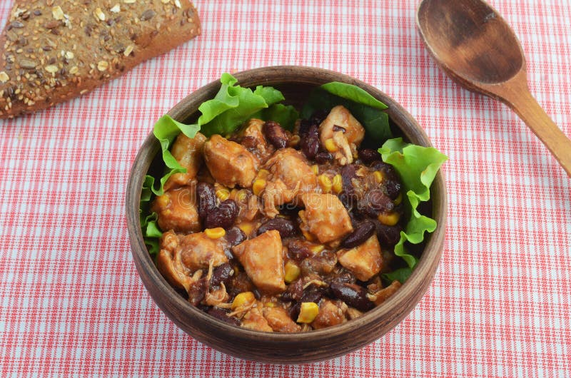 A bowl of meat and bean chili con carne. Traditional Mexican and Chilean food.