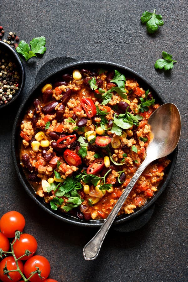 Chili Con Carne Classic Mexican Dish on the Kitchen Table, Top View