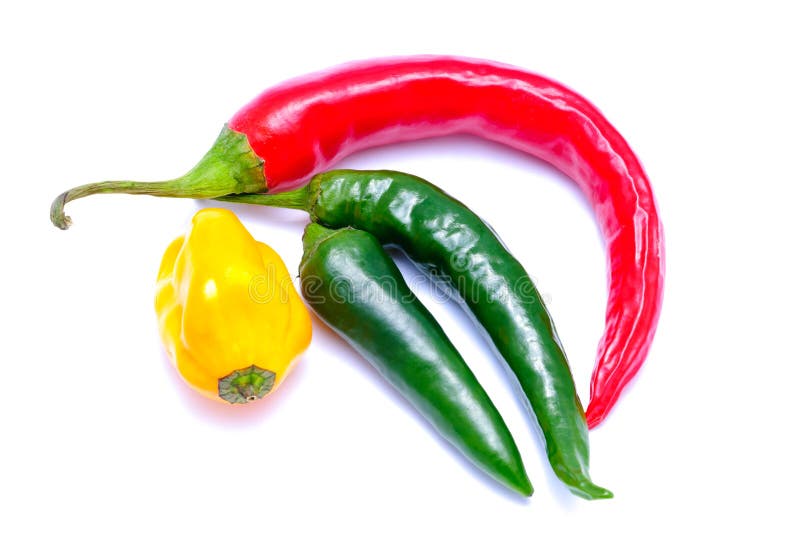 Red, green and yellow chili peppers isolated on a white background