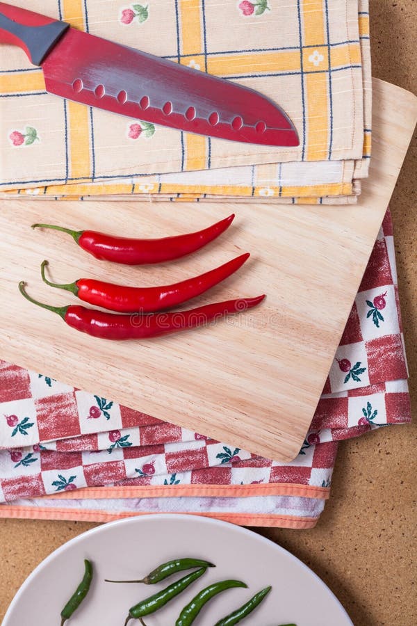 Chili Peppers and Knife on Chopping Board Stock Photo Image of cooking, cuisine 53464696