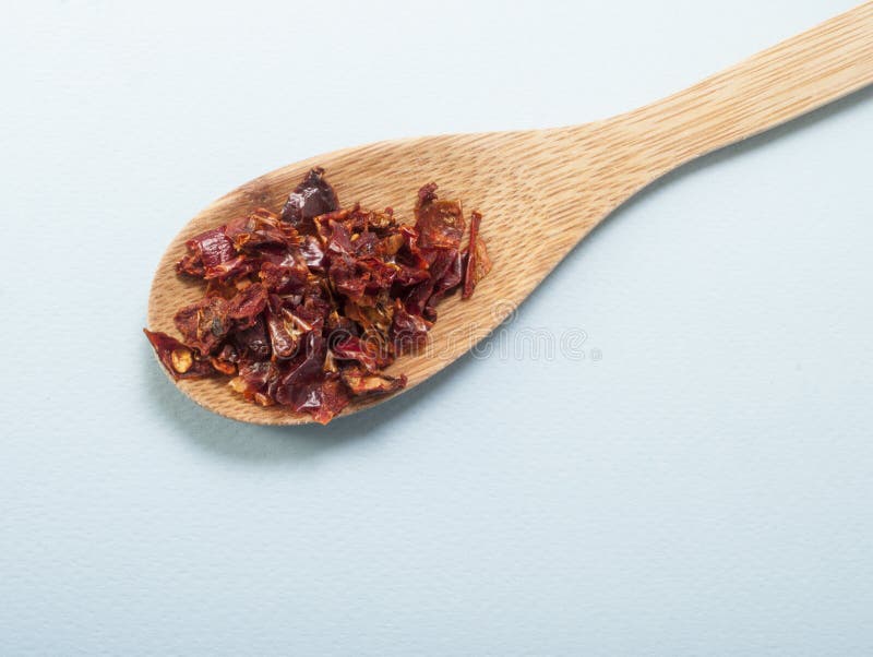 Chili peppers wooden spoon royalty free stock photos