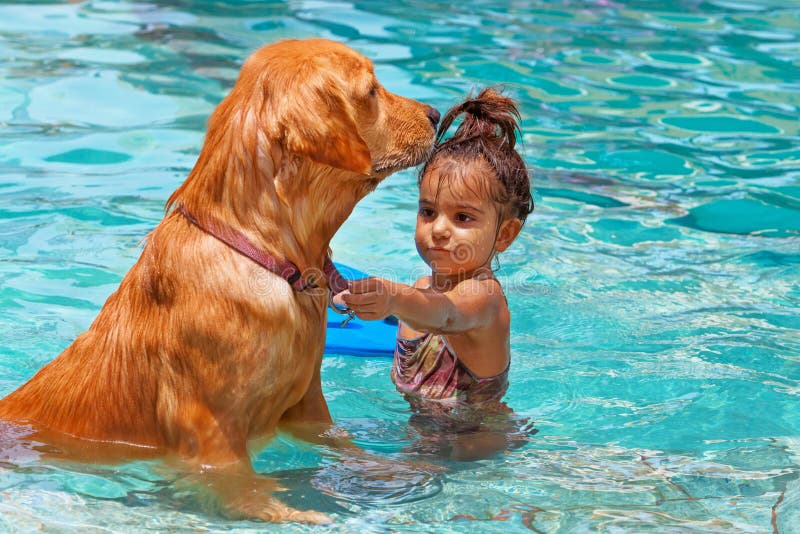 Chilld with dog in swimming pool